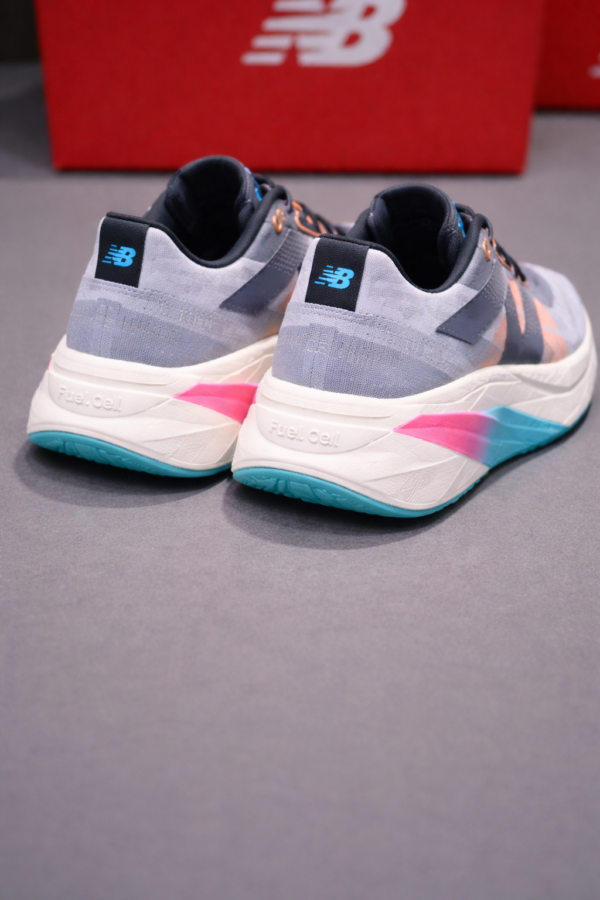 Men’s Premium Grey Multicolor RStylish and performance-ready running shoes with multicolor cushioning and breathable comfort for everyday wear.unning Shoes with FuelCell Cushion