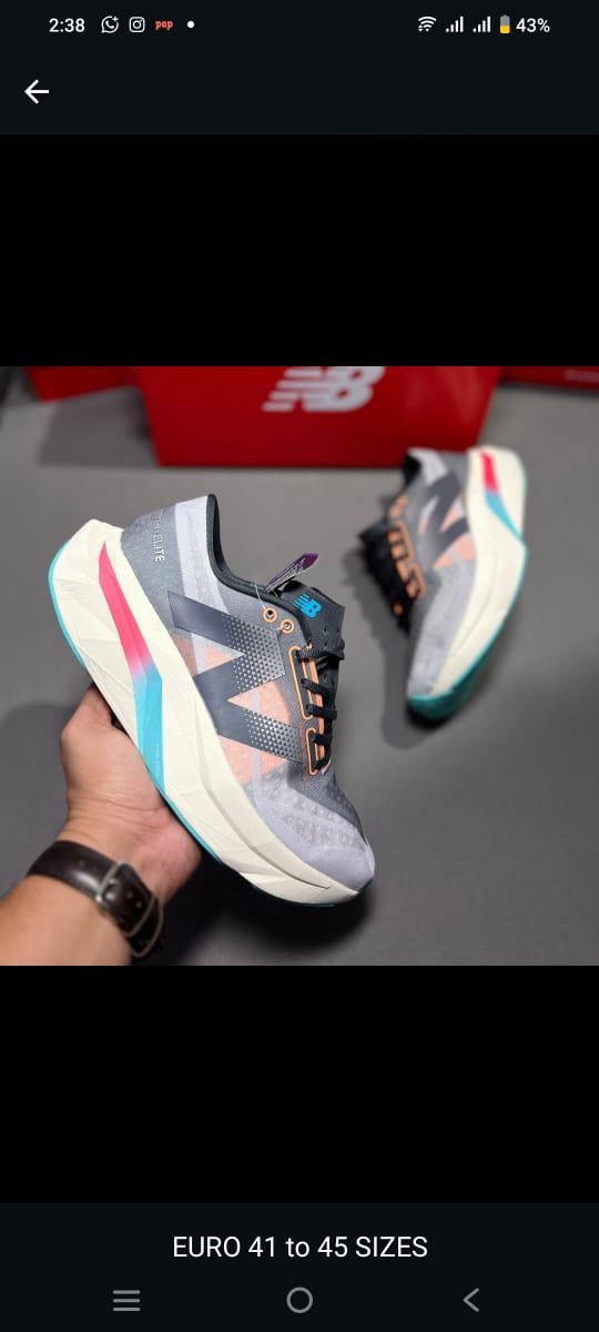 Men’s Premium Grey Multicolor RStylish and performance-ready running shoes with multicolor cushioning and breathable comfort for everyday wear.unning Shoes with FuelCell Cushion